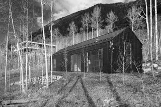 Cottage Black in nestled in the aspen grove below the main house.