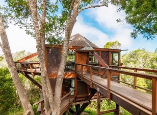 Located just outside of San Francisco in Santa Cruz, California, this heavenly home is perfect for a weekend getaway if you're in the bay area. Complete with ocean views and large glass windows that surround the entire structure, it can sleep up to six guests.