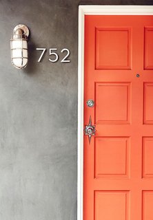 This front door should be all the proof you need to decide that when it comes to doors, orange is the new black. It might be brunch feelings talking, but the bright hue reminds me of a perfect blood-orange mimosa. Needless to say, I've personally got a little orange crush on this one.