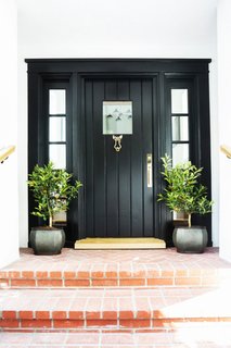 This is a door we adore. There's something so stylishly simple about a classic black door and frame that reminds us it's time to step up.