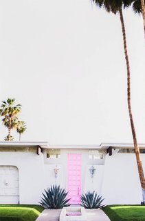 Hello from the outside. This inspiring midcentury pink door is just the right hue for a design style that's retro with a little bit of feminine flair. The bright shade hits the sweet spot between bubblegum and blush for pure Palm Springs perfection.