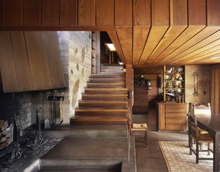 The Wood-Peterson house in Colorado Springs was built in 1950 by Ingraham and Ingraham, Architects, who used flat fieldstone set in poured concrete through much of the home. You'll notice they kept the stairwell clean by eliminating a railing and included built-in cabinets that appear in many of their homes.