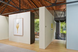 Free-standing walls highlight the couple's noteworthy art collection. "The owner has a phenomenal eye," says architect Martin Marciano. "She could be curating in any modern art museum."