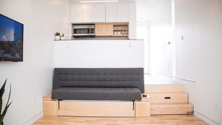 Can These Tiny, Modular Smart Homes Relieve the Demand For Affordable Housing? - Photo 2 of 8 - The sofa converts to a queen-size bed complete with a Casper mattress. Bedding tucks away neatly in the storage below.