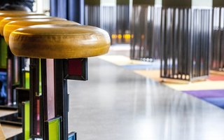 "This was a good project for me, because of how I approach things and think," says Heisner. "Frank Lloyd Wright would design all the elements, including the furniture, and that’s what my construction company had already been doing. It was serendipitous." Heisner designed all the furniture elements at Chicago's Prairie School bar.