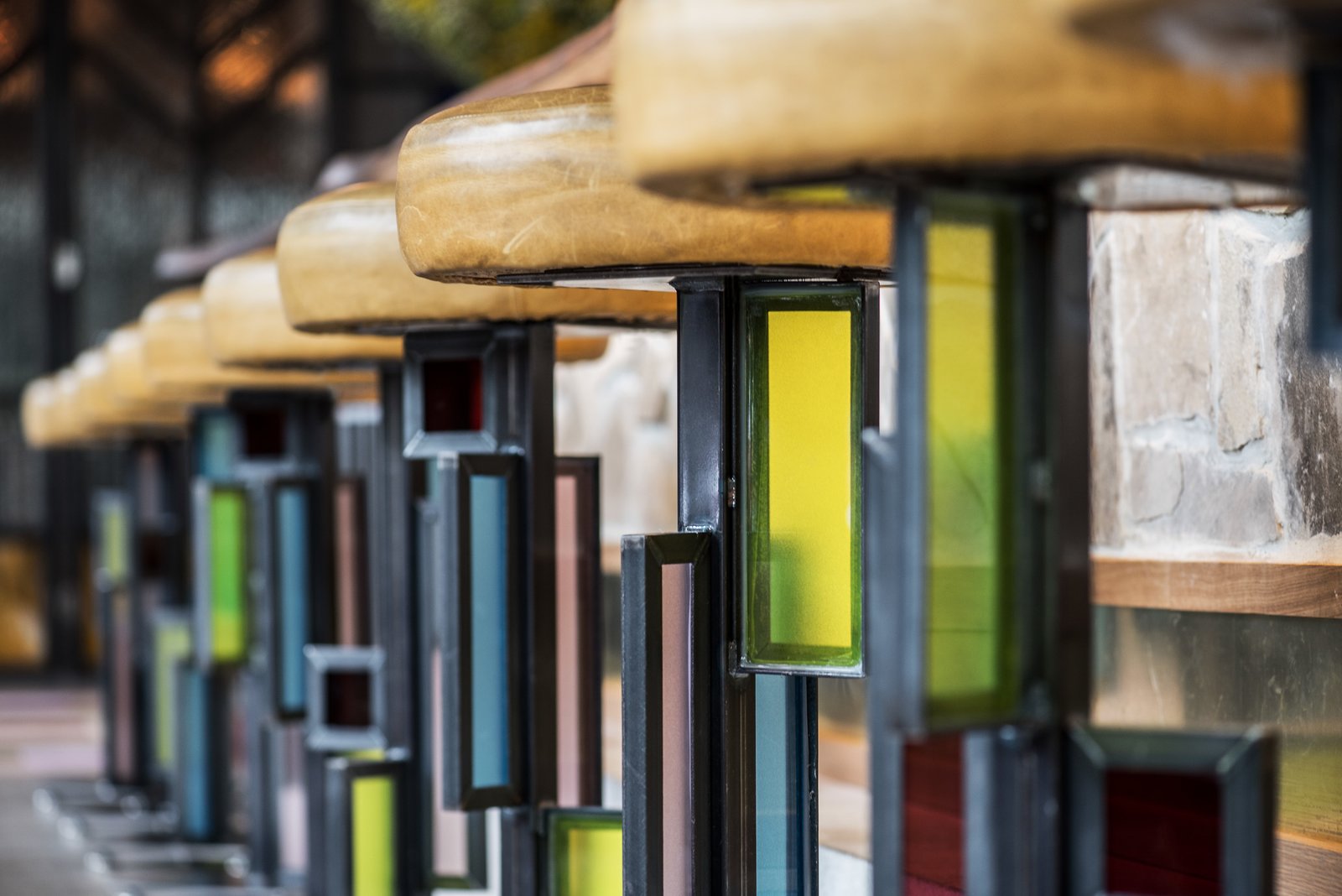 Designer Kevin Heisler designed and fabricated the custom, stained-glass barstools.
