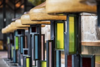 Designer Kevin Heisner designed and fabricated the custom, stained-glass barstools.