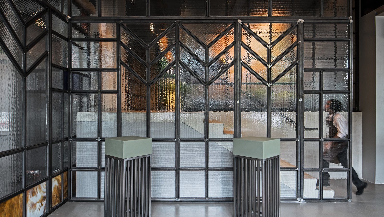"Looking at the stained glass, I started there and scaled up," says designer Kevin Heisler. "I wanted to create great scale with no seam, so it doesn’t feel like a door."