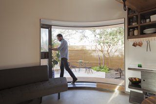 "The sliding door, when you open it, opens a large chunk of living space that more than doubles the perceived space," says Christoph Kaiser. "The big aperture moves and connects you with the lush, desert garden."