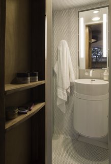 The ergonomic bath was intentionally designed with an outdoor shower to maximize square footage inside the silo house. 
