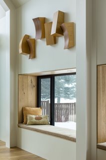 The homeowners are avid readers, and built-in reading nooks cater to their lifestyle and add warmth to the interiors. 