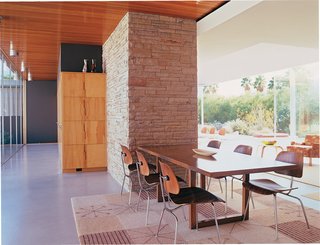 Slight modernization was thoughtfully incorporated into the restoration, including a cooling solution. "We wanted to lengthen the life of the home and make it more enduring," says Ron Radziner of Marmol Radziner. Air conditioning was added in a concealed fashion. Above, where the wood meets the plaster at the ceiling, an air return is carefully hidden, and ducting runs beneath the floor.