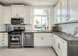 Kitchens range from compact, galley kitchens to open plans like the one above in the larger of the four units at Palm Canyon Mobile Club.
