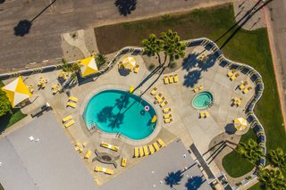 Palm Canyon Motor Club is home to 100 plots dedicated to modern tiny homes. The mobile park setting eases permitting woes and offers community amenities such as a dog park, socials, and "one of the nicest pools in town," according to realtor Paul Kaplan.