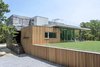 Modern home with Exterior, House Building Type, Prefab Building Type, Wood Siding Material, Glass Siding Material, and Flat RoofLine. Entry Photo 2 of Sandbox