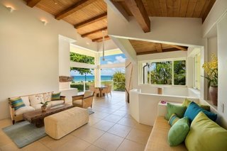 Living room in Main House with 15 ft high ceilings and expansive ocean views 