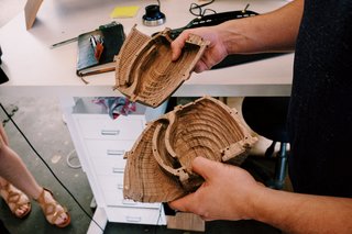 Sean Kelly showing off the CNC-routed ridges that form the innards of their new wood speakers.