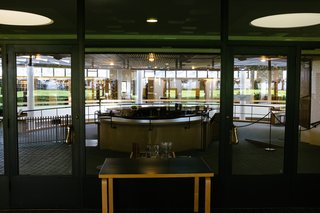 Even through the reflections, glass, and steel, Aalto's ceiling lattice pattern begins to emerge.