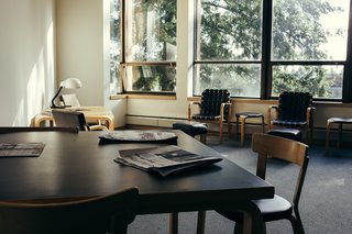 Aalto's furniture steals the show in this periodical "sitting room" designed for relaxing and reading.