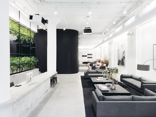 A Look Inside Squarespace NYC - Photo 1 of 10 - The cavernous and light-flooded entry contrasts blacks and whites with bursts of life.