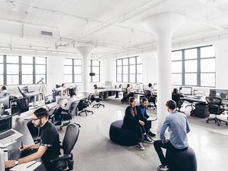 A Look Inside Squarespace NYC - Photo 3 of 10 - A work area is flooded with massive amounts of natural light.