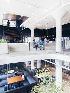A Look Inside Squarespace NYC - Photo 4 of 10 - Glass lines multiple surfaces up and down in this view of the atrium.