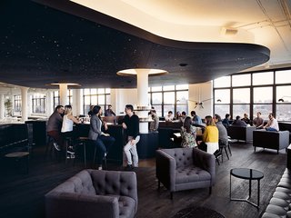 A Look Inside Squarespace NYC - Photo 9 of 10 - Dark hues, warm light, and curved tones constrast the straight, white lines seen elsewhere.