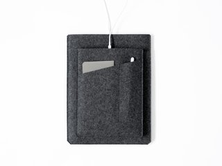 A minimal felt sleeve to hold an iPad Pro, notepad, and Apple Pencil.