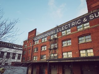 An exterior view of Schoolhouse's factory and warehouse showroom space.