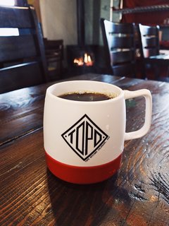 The hot steam and warm fire make a nice backdrop to this scene. VSCO RAW captures light beautifully with a range of expression. Notice the steam billowing out of the insulated mug.