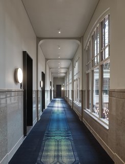 Formerly a Historic Bank, This Amsterdam Hotel Honors its Stately Roots - Photo 8 of 14 - A long view down the corridor of the second floor.