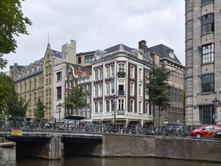 Formerly a Historic Bank, This Amsterdam Hotel Honors its Stately Roots - Photo 14 of 14 - An exterior view highlight’s the hotel’s façade and how the building seamlessly fits in the surrounding neighborhood.
