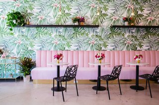 Holy Matcha in San Diego sports wall adorned with bright, floral wallpaper than tranforms the company's retail space.
