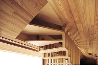 The open airy design of the stairway is revealed—creating a unique pattern that is reflected in staircase railings and vents.