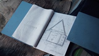Bound books reveal detailed plans for bringing the Yoshino Cedar House to life.