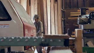 Workers prepare cedar planks for use in Yoshino Cedar House.