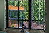 Modern home with Bedroom and Dark Hardwood Floor. The two halves of the house face each other across a courtyard. As a result, the homeowners can enjoy the exterior of their new house from the interior and watch the steel reach its ultimate patina.
Photo 10 of Piedmont Retreat