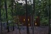 Modern home with Outdoor, Side Yard, and Trees. As the Corton steel blends the house into its setting, light from side windows appear like lanterns through the forest. Photo 12 of Piedmont Retreat