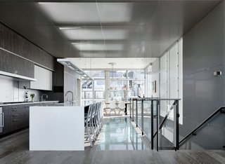 With a long and narrow layout common to San Fransisco homes, natural light is often limited to only two ends of the house. The solution? The airy warmth of bleached white oak, and translucent glass used to bring light from the well-fenestrated top floor down to the lower levels along with the stairwell.