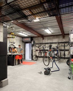 This room is a far cry from the overcrowded garage the homeowners previously managed. But it was difficult for them to find a house that was just the right size with an oversized garage. "That was a huge component of why we ended up building a house," said the cycling coach who now delights in his private, bike maintenance facility. 