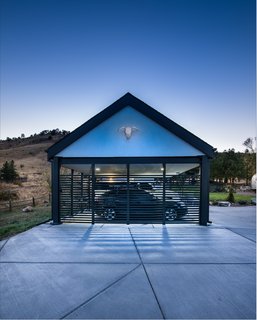 Additional structures on the property include a carport and a shed constructed of reclaimed wood to house the couple's outdoor gear. The Airstream where Garcia and Adamson lived during the construction of their small house remains nearby. 