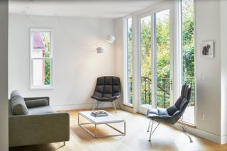 The back of the house serves as the greatest departure from the otherwise preserved proportions of the original Victorian farmhouse. With the thoughtful insertion of a "glass dining cube" and a rehabilitated deck space with sliding doors that can stand open, an outdoor living space creates additional programmatic flexibility while reinforcing the indoor/outdoor connection. 
