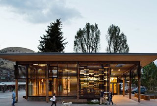 HOME RANCH – Jackson Hole’s Home Ranch Welcome Center rests at the northern entrance to historic downtown, where it provides visitor information about opportunities for discovery in the town of Jackson and the surrounding National Parks. Program components are expressed individually, as an opaque concrete enclosure houses restroom facilities, and a gallery on the public corner is light-filled and transparent. Inspiration for the project was taken from the regional abundance of porches, which provide welcome, shelter, and entry for natives and tourists alike. Carney Logan Burke also worked with a local artist to create Jackson’s first publicly funded art project, Strands. The work is made of glass bricks representing bison and bear DNA, and those bricks are integrated into the building’s solar shade screens. The Home Ranch Welcome Center won three AIA Awards, including a 2014 Award of Excellence from the Wyoming Chapter. Photo by Paul Warchol.