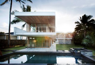 The house's L-shaped form creates a dialogue in which the yard becomes an integral, outdoor room for the home. Designed with walls and windows that "disappear" when opened, the architectural elements reinforce the Hawaiian lifestyle in which lines are consistently blurred between the time spent indoors and outdoors.