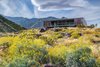 The Beadle House appears to float above the landscape, set upon a pedestal-like foundation. Photo 3 of Desert Palisades Chino Canyon modern home