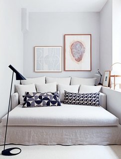10 Effective Tips For Making the Most Out of Small Space Interiors - Photo 3 of 10 - Pairing patterned throw pillows with a neutral sofa creates a soothing palette in a tight space. 