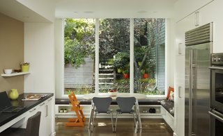5 Main Ingredients For Cooking Up a Homey Kitchen Nook - Photo 4 of 8 - Form meets function with a banquette that boast built-in shoe storage and an easy-to-clean seat cushion.