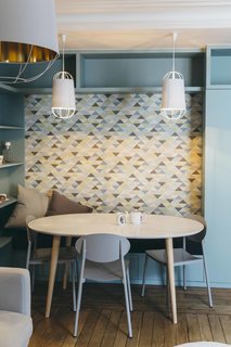 5 Main Ingredients For Cooking Up a Homey Kitchen Nook - Photo 6 of 8 - Chairs with clean lines in a signature hue add punch to small breakfast nook. 