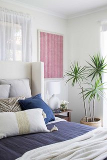 Layered throw pillows add color, texture and subtle pattern. 