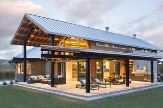 "The central pavilion evolved as a place to house a lot of the functions of the home, and also gave us a structure to build porches and decks for further protection from the sun," says Dominick. The outdoor patio is 1,600 square feet.
